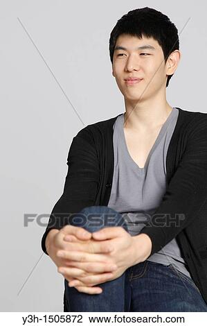 Studio shot of Korean man View Large Photo Image Stock Image - Studio shot of Korean man. Fotosearch