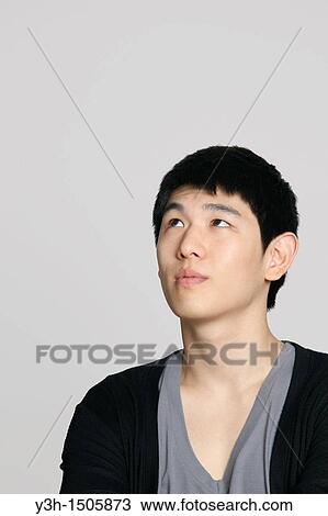 Studio shot of Korean man View Large Photo Image Stock Image - Studio shot of Korean man. Fotosearch