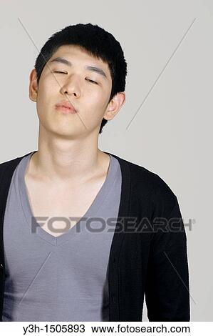 Studio shot of Korean man View Large Photo Image Stock Image - Studio shot of Korean man. Fotosearch