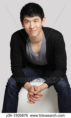 Studio shot of Korean man View Large Photo Image Stock Photograph - Studio shot of Korean man. Fotosearch