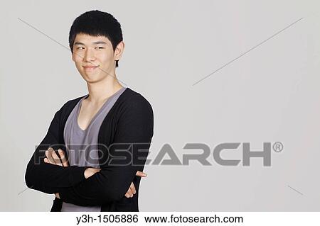 Studio shot of Korean man View Large Photo Image Stock Photograph - Studio shot of Korean man. Fotosearch
