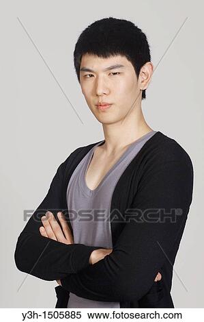 Stock Photography - Studio shot of Korean man. Fotosearch
