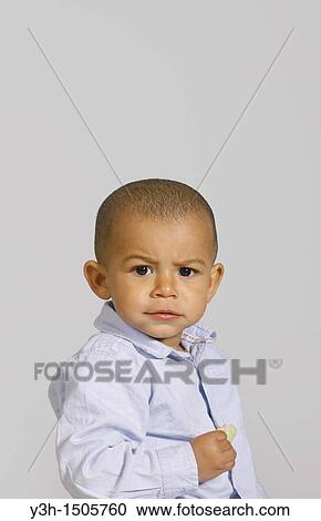 Studio shot of little boy View Large Photo Image Stock Image - Studio shot of little boy. Fotosearch