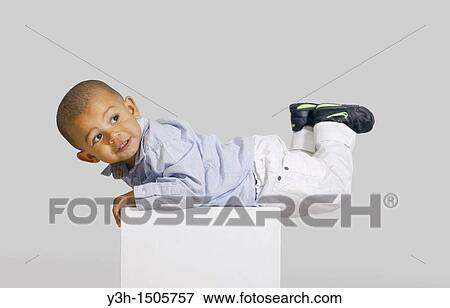 Studio shot of little boy View Large Photo Image Stock Photo - Studio shot of little boy. Fotosearch