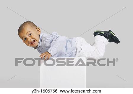 Studio shot of little boy View Large Photo Image Stock Photograph - Studio shot of little boy. Fotosearch