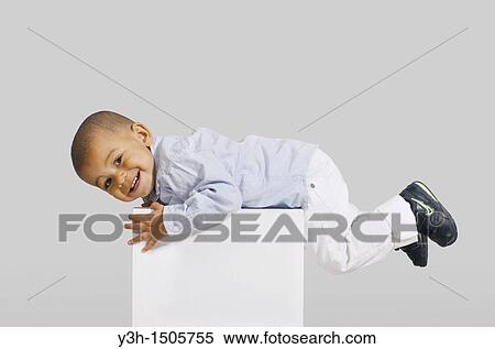 Studio shot of little boy View Large Photo Image Stock Photography - Studio shot of little boy. Fotosearch