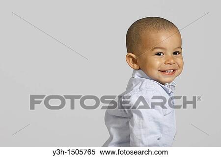 Stock Photography - Studio shot of little boy. Fotosearch