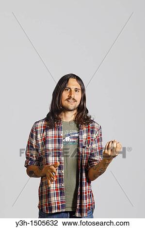 Studio shot of man, air guitar View Large Photo Image Stock Image - Studio shot of man, air guitar. Fotosearch