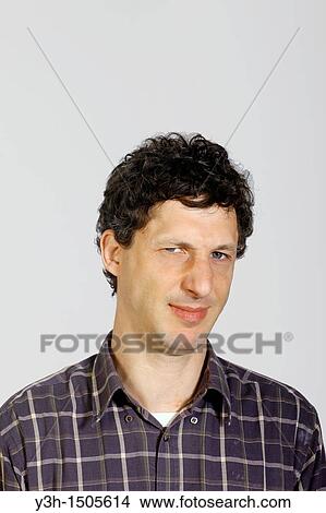 Picture - Studio shot of man, disgusted. Fotosearch