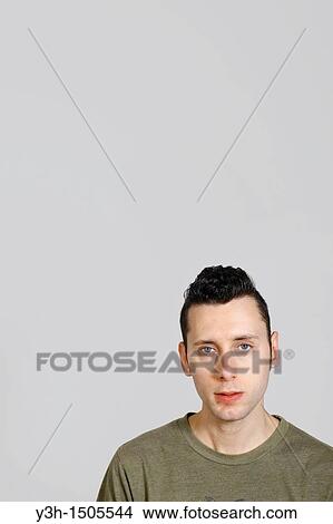Studio shot of man, looking at camera View Large Photo Image Picture - Studio shot of man, looking at camera. Fotosearch