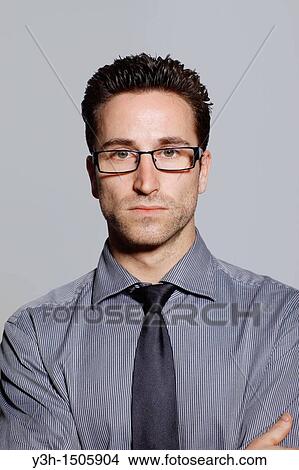 Studio shot of man, looking at camera View Large Photo Image Picture - Studio shot of man, looking at camera. Fotosearch