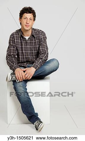 Studio shot of man, looking at camera View Large Photo Image Stock Image - Studio shot of man, looking at camera. Fotosearch