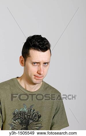 Stock Photo - Studio shot of man, looking at camera. Fotosearch