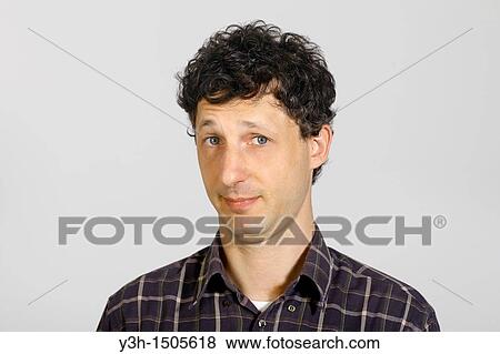Stock Photo - Studio shot of man, looking at camera. Fotosearch