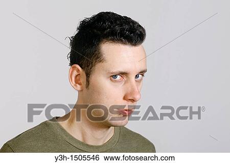 Studio shot of man, looking sideways View Large Photo Image Stock Photograph - Studio shot of man, looking sideways. Fotosearch