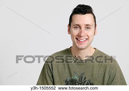Studio shot of man, smiling View Large Photo Image Stock Image - Studio shot of man, smiling. Fotosearch