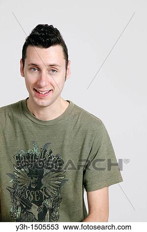 Stock Image - Studio shot of man, smiling. Fotosearch