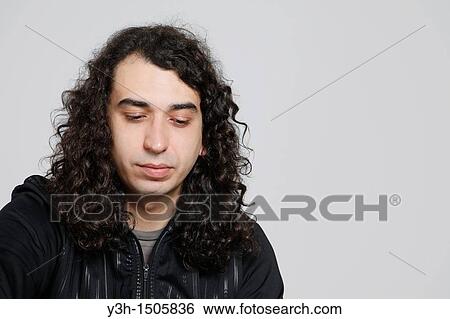 Stock Photograph - Studio shot of man. Fotosearch