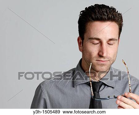 Studio shot of man, stressed View Large Photo Image Stock Photo - Studio shot of man, stressed. Fotosearch