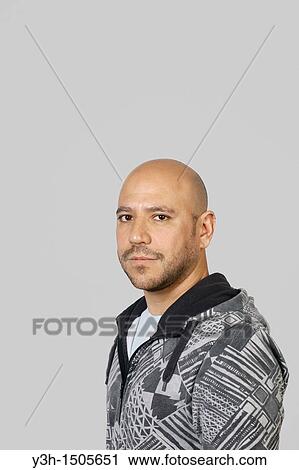 Studio shot of Mexican man, looking at camera View Large Photo Image Stock Image - Studio shot of Mexican man, looking at camera. Fotosearch