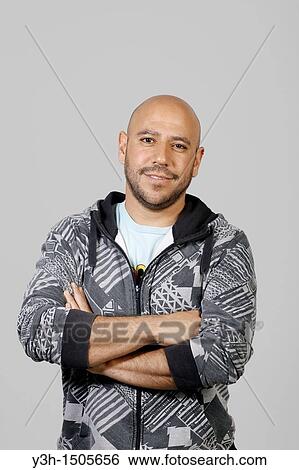 Studio shot of Mexican man, looking at camera View Large Photo Image Stock Photograph - Studio shot of Mexican man, looking at camera. Fotosearch