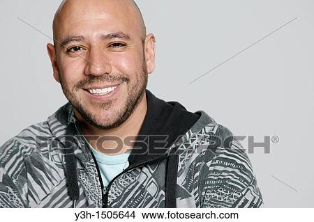 Studio shot of Mexican man, smiling View Large Photo Image Picture - Studio shot of Mexican man, smiling. Fotosearch