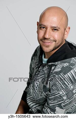 Studio shot of Mexican man, smiling View Large Photo Image Stock Image - Studio shot of Mexican man, smiling. Fotosearch