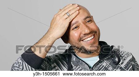 Studio shot of Mexican man, smiling View Large Photo Image Stock Image - Studio shot of Mexican man, smiling. Fotosearch