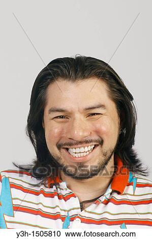 Studio shot of Mexican man View Large Photo Image Stock Image - Studio shot of Mexican man. Fotosearch