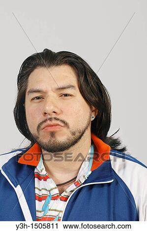 Studio shot of Mexican man View Large Photo Image Stock Image - Studio shot of Mexican man. Fotosearch