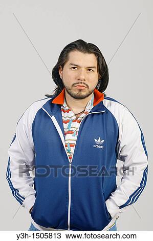 Stock Image - Studio shot of Mexican man. Fotosearch