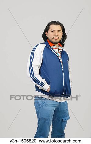 Stock Image - Studio shot of Mexican man. Fotosearch
