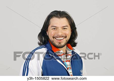 Stock Image - Studio shot of Mexican man. Fotosearch