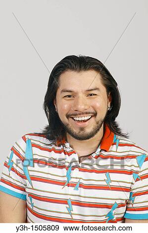 Studio shot of Mexican man View Large Photo Image Stock Photo - Studio shot of Mexican man. Fotosearch