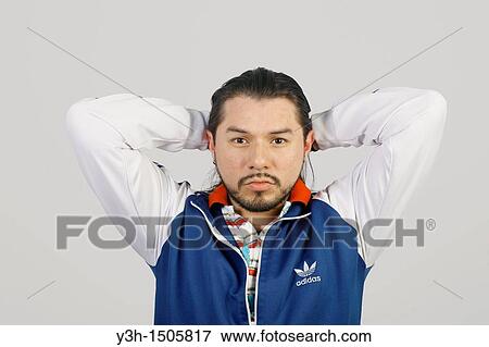 Stock Photo - Studio shot of Mexican man. Fotosearch