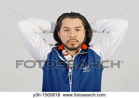 Stock Photo - Studio shot of Mexican man. Fotosearch