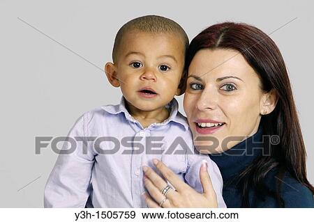 Studio shot of mother and child View Large Photo Image Stock Photo - Studio shot of mother and child. Fotosearch