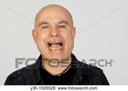 Stock Photo - Studio shot of senior man, laughing. Fotosearch