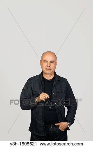 Studio shot of senior man, looking at camera View Large Photo Image Stock Image - Studio shot of senior man, looking at camera. Fotosearch