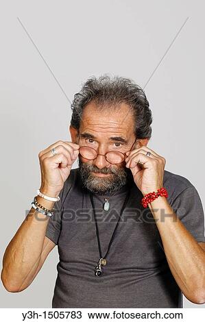 Studio shot of senior man, looking at camera View Large Photo Image Stock Image - Studio shot of senior man, looking at camera. Fotosearch