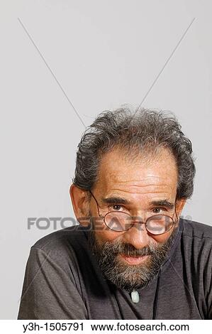 Studio shot of senior man, looking at camera View Large Photo Image Stock Image - Studio shot of senior man, looking at camera. Fotosearch