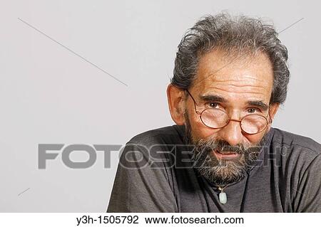Studio shot of senior man, looking at camera View Large Photo Image Stock Image - Studio shot of senior man, looking at camera. Fotosearch