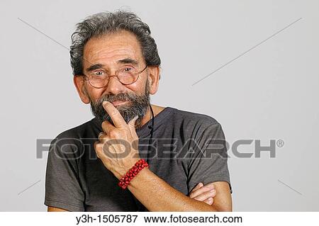 Studio shot of senior man, looking at camera View Large Photo Image Stock Photo - Studio shot of senior man, looking at camera. Fotosearch