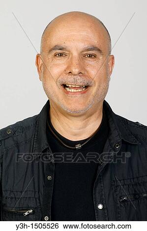 Stock Photograph - Studio shot of senior man, smiling. Fotosearch