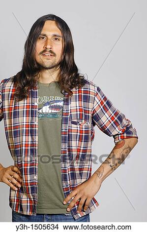Studio shot of tattooed man View Large Photo Image Picture - Studio shot of tattooed man. Fotosearch