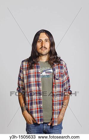 Studio shot of tattooed man View Large Photo Image Stock Image - Studio shot of tattooed man. Fotosearch