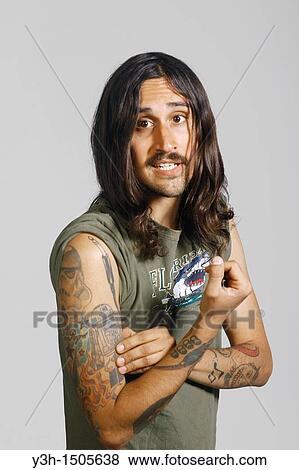 Stock Photo - Studio shot of tattooed man. Fotosearch