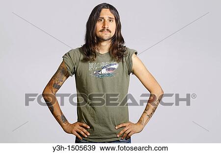 Studio shot of tattooed man View Large Photo Image Stock Photo - Studio shot of tattooed man. Fotosearch