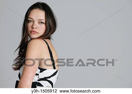 Stock Image - Studio shot of teen girl. Fotosearch