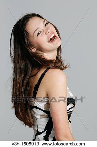 Stock Image - Studio shot of teen girl. Fotosearch